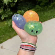 Load image into Gallery viewer, Squishy Toy - Viral Dumpling, Quick Squeeze Glitter - Orange
