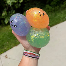 Load image into Gallery viewer, Squishy Toy - Viral Dumpling, Quick Squeeze Glitter - Orange
